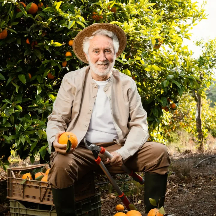 elderly-man-with-fresh-oranges